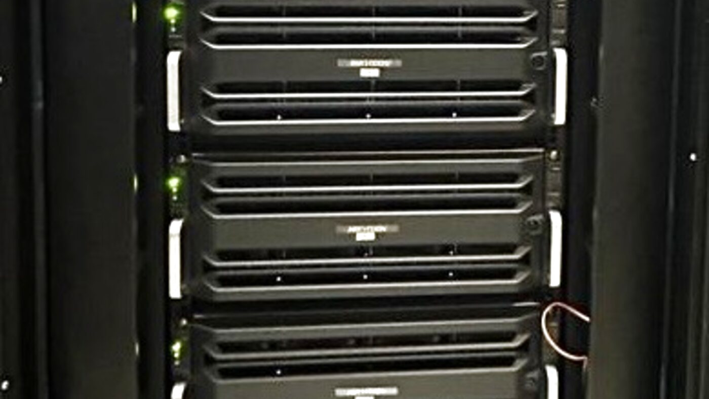 Rack-mounted servers and storage with status LEDs powering Harvs International big-data structuralisation pipelines.